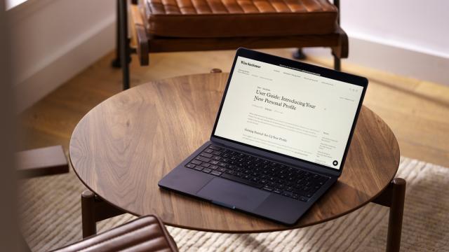 Laptop on Table showing user guide page